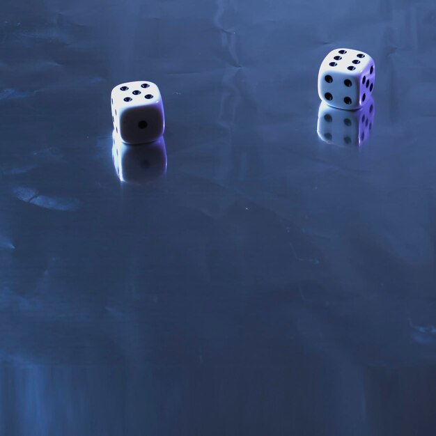Photo two dice on silver background static