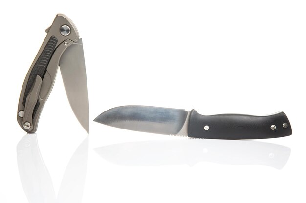 two different folding knives on a white background item for tourism and survival