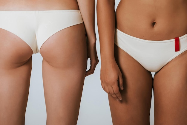 Photo two different girls in beautiful underwear, face and back