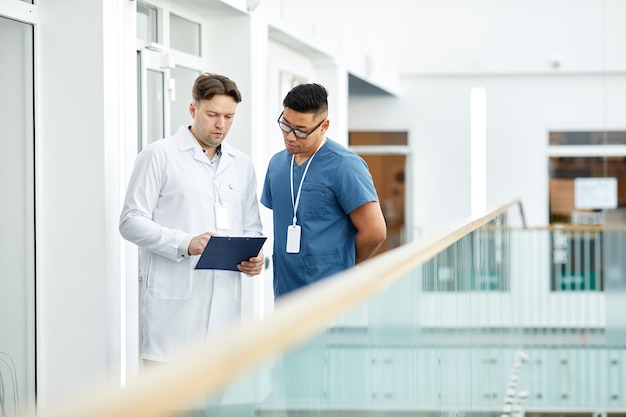 Two Doctors in Hall of Clinic