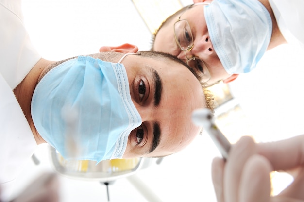 Two doctors in surgery room working 