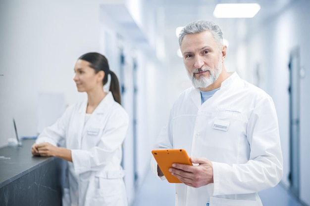 Two doctors talking in the hospital during the shift change