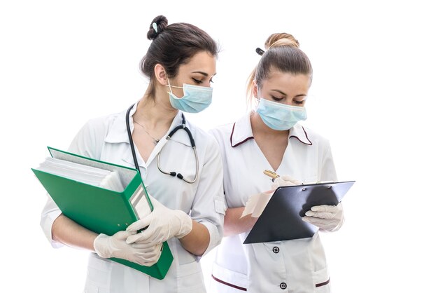 Two doctors with documents isolated on white