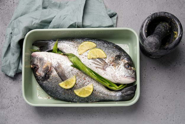 Two dorado fish in baking dish