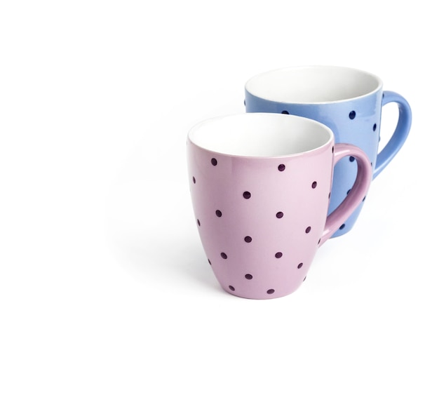 Two dotted teacups isolated