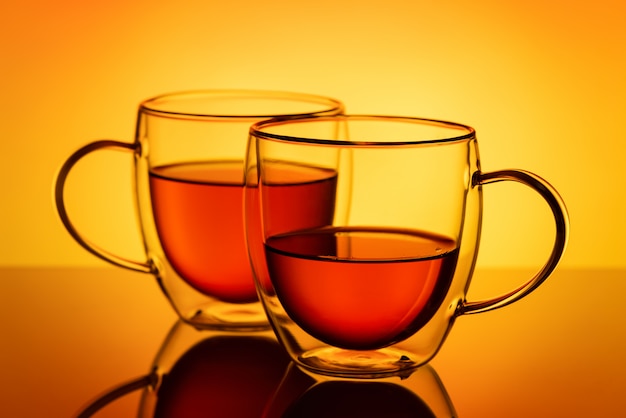 Two double wall glass cups with tea