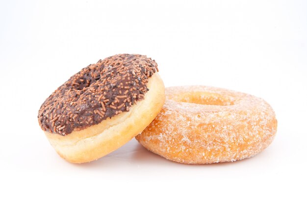 Two doughnuts with icing sugar