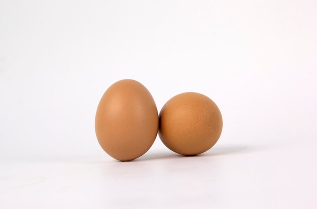 Two eggs isolated on white background