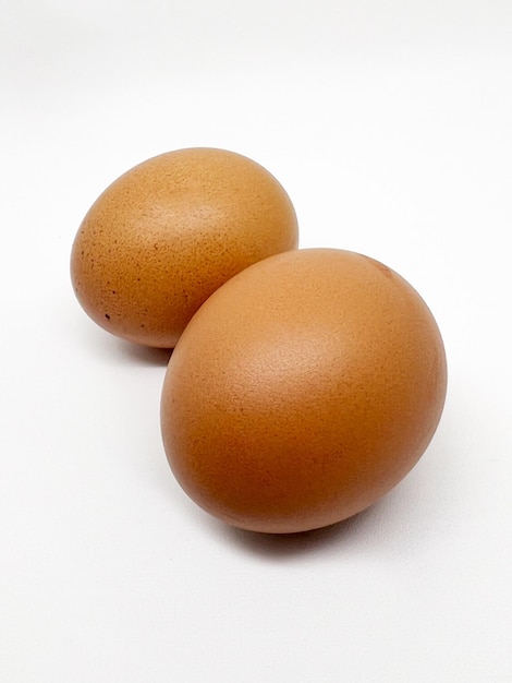 Two eggs on a white background