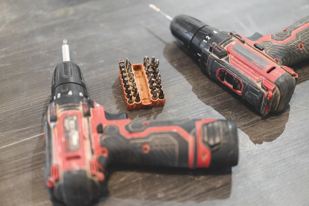 Photo two electric screwdrivers or drills for screwing and drilling