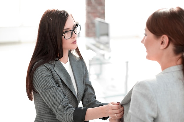 Two employees on the background of a modern office