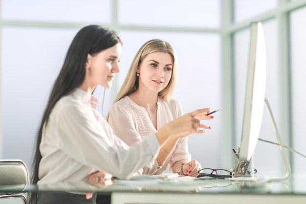 Two employees sitting at the office Desk