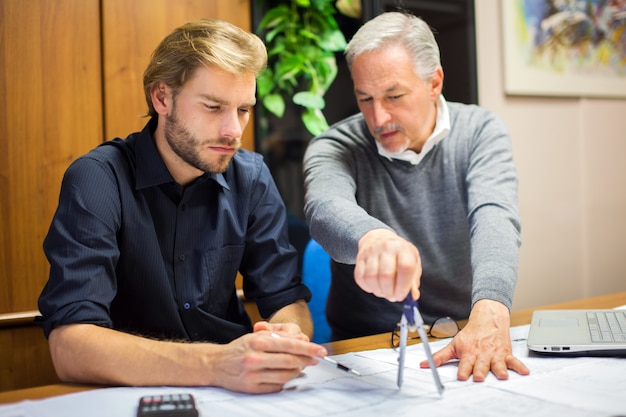 Two employees at work in an office