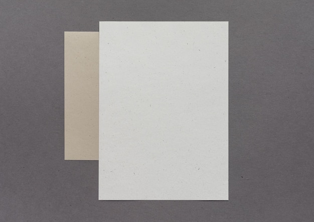 Two empty eco paper sheets on background
