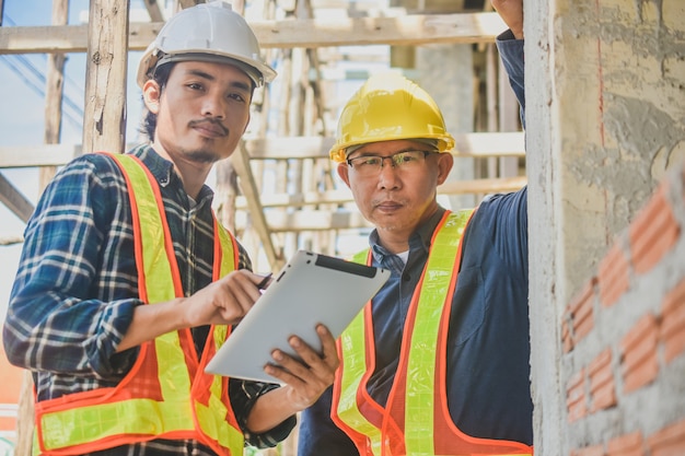 Two Engineer tablet inspection site construction real estate