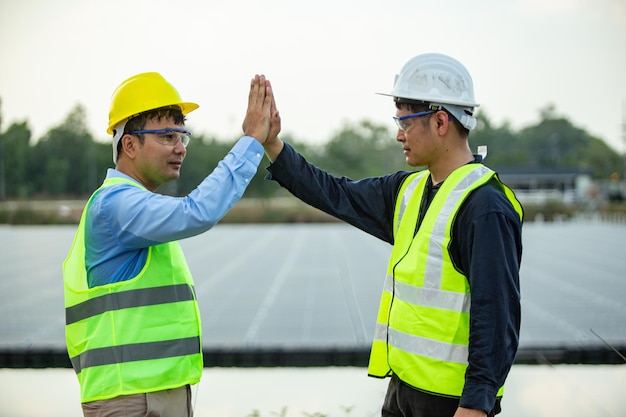 Two Engineer worker working together at Solar panel