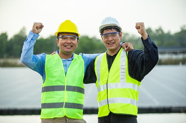 Two Engineer worker working together at Solar panel