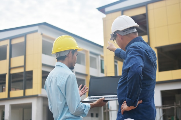 Two engineers talking outdoors