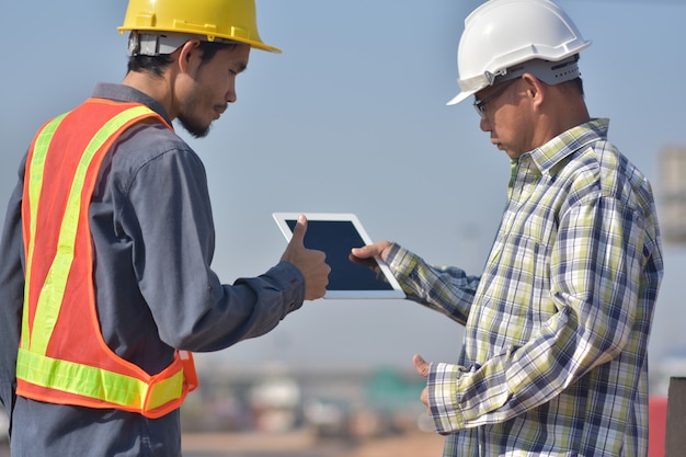 Two engineers talking outdoors