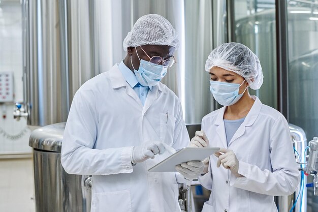 Two engineers working on tablet pc