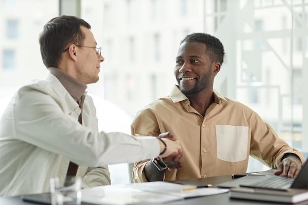 Two entrepreneurs shaking hands