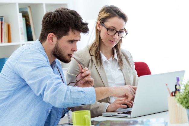 Two entrepreneurs working in the modern office.