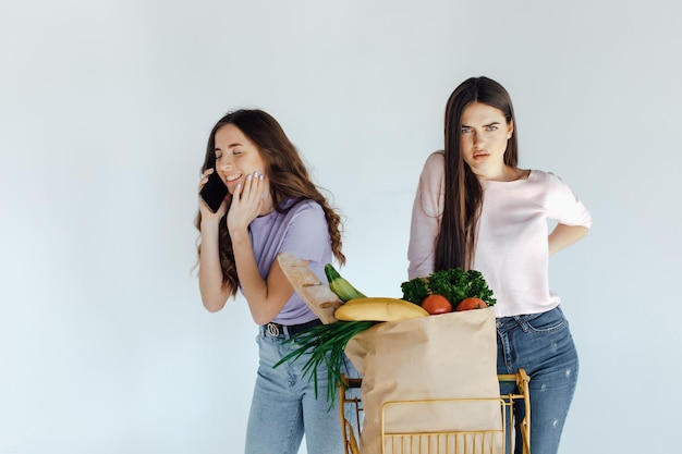 Two european girls having fun after shopping