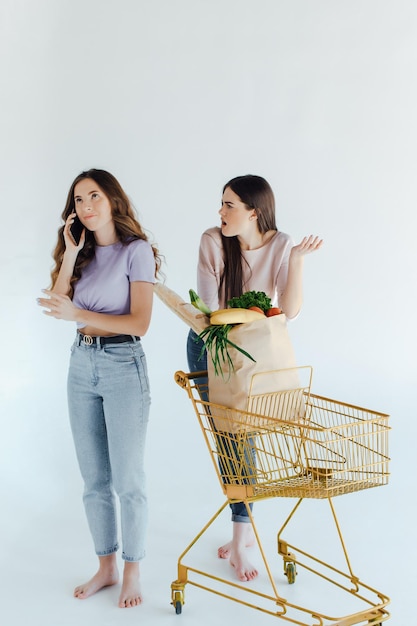 Two european girls having fun after shopping