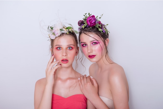 Two fashion beauty models with professional bright make-up