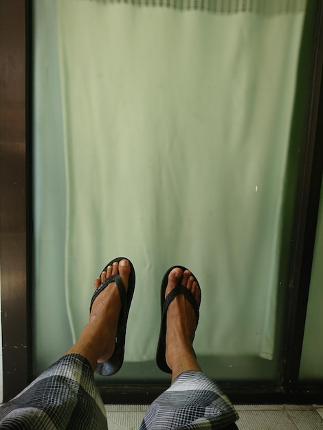 Photo two feet wearing black sandals