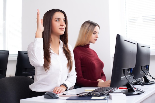 Two female colleagues in office working together