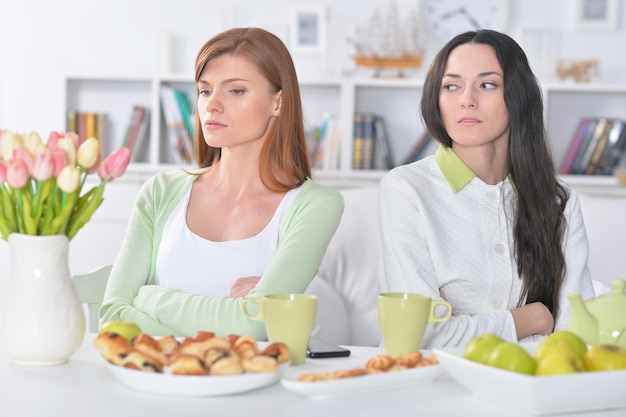 Two female friends after quarrel