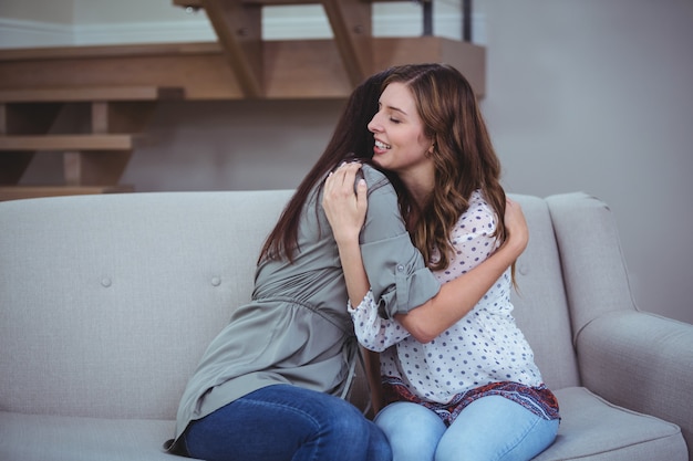 Two female friends embracing each other