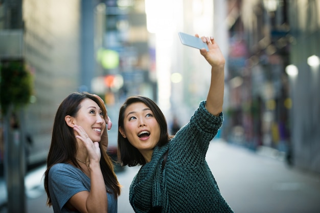 Two female friends meeting in Tokyo