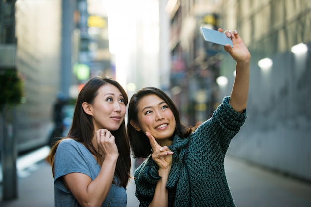 Two female friends meeting in Tokyo