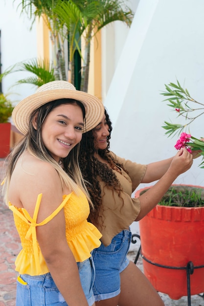 Two Female Friends Walking Down The Street