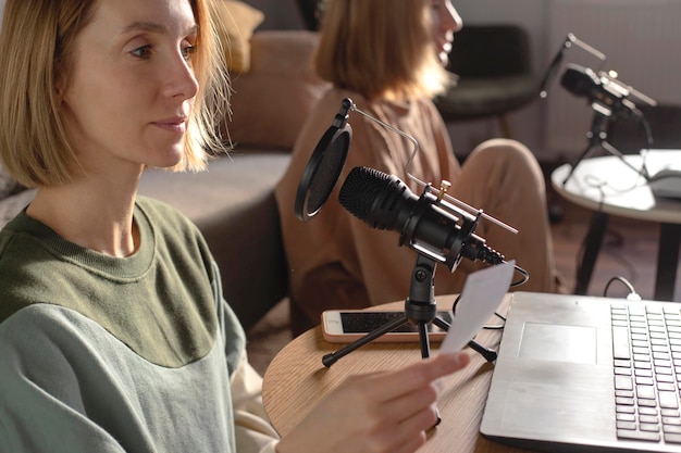 Two Female Podcast Producers Recording Together in a Home Studio