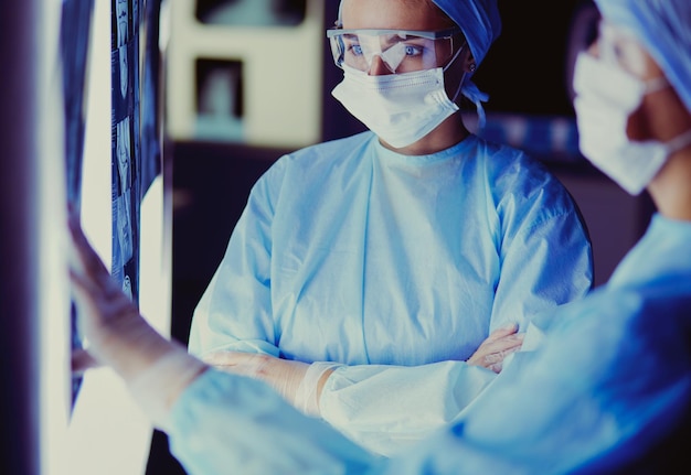 Two female women medical doctors looking at xrays in a hospital