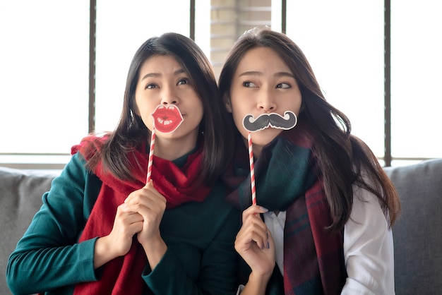 Two Females enjoy to celebrate Christmas and new year party at home in December