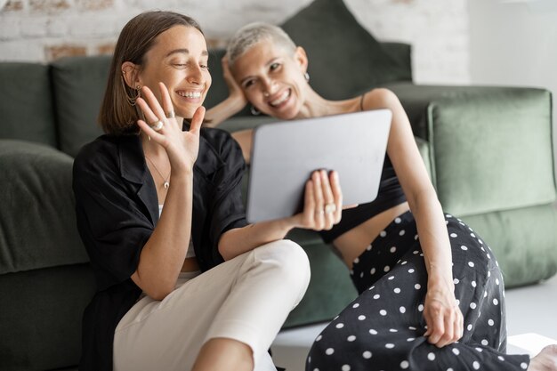 Photo two females having a video call from home