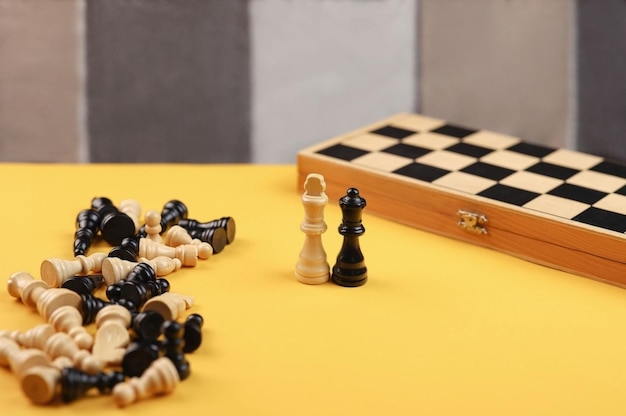 two figures on the background of chess on the table