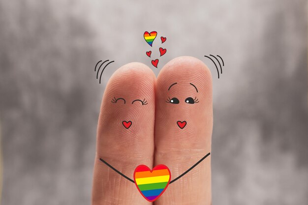 Two fingers are like two cartoon people who love each other.\
same sex love, lgbt, pride day.