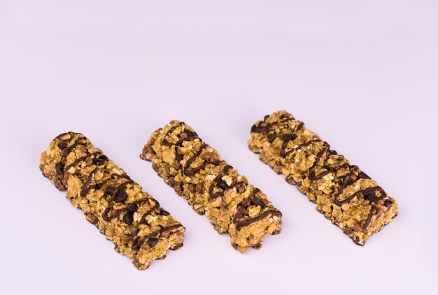 Photo two fitness cereal bars on a black background. close-up.