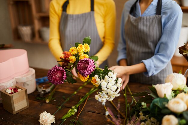 Two Florists Arranging Flowers Closeup