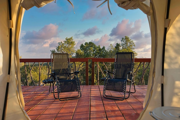 Two folding deck chairs at the campsite