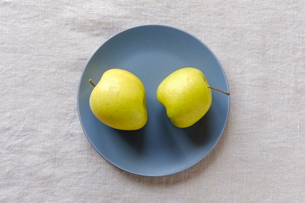 Two fresh healthy golden apples with ugly shapes