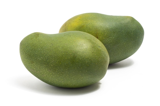 Two fresh organic green mango delicious fruit side view isolated on white background clipping path