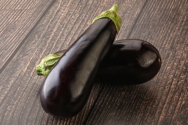 Photo two fresh ripe black eggplants