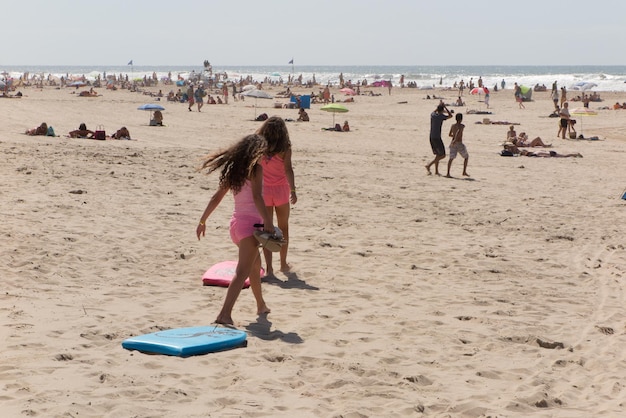 Two friends on the beach young girls