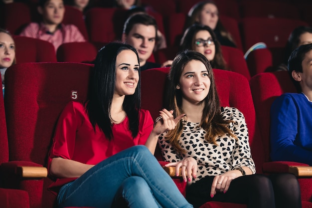 Two friends in the cinema on comedy